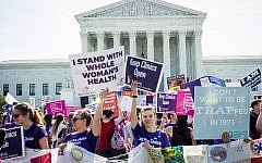 Illustrative: Pro-choice and pro-life activists demonstrate on the steps of the United States Supreme Court in Washington, DC, on June 27, 2016. (Pete Marovich/Getty Images/AFP)