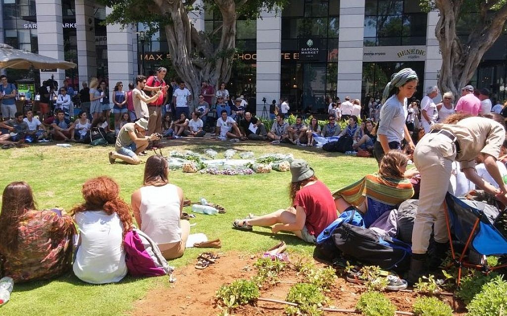 Teenage members of a pre-army program set up an impromptu memorial for the victims of a terror attack a day prior at the Max Brenner cafe at the Sarona Market in central Tel Aviv, June 9, 2016. (Ricky Ben-David/Times of Israel) Teenage members of a pre-army program set up an impromptu memorial for the victims of a terror attack a day prior at the Max Brenner cafe at the Sarona Market in central Tel Aviv, June 9, 2016. (Ricky Ben-David/Times of Israel)