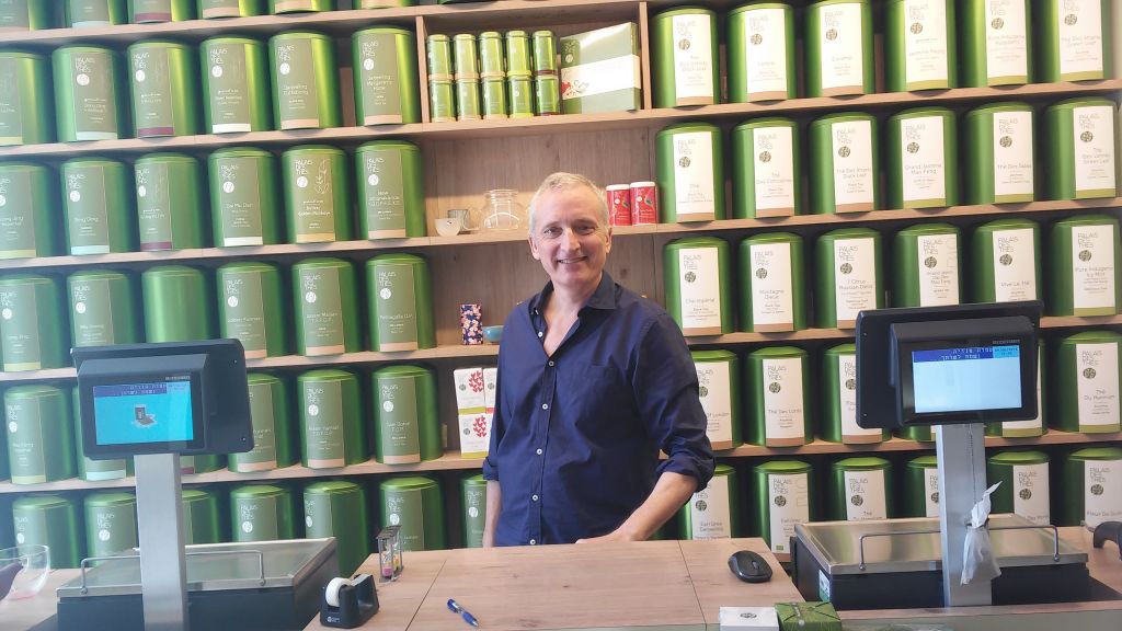 Charles Peguine in his tea shop near the site of the terror attack, June 9, 2016 (Simona Weinglass/Times of Israel)