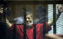 Former Egyptian president Mohammed Morsi in a makeshift courtroom at the national police academy, in Cairo, Egypt, Saturday, June 18, 2016. (AP/Amr Nabil)
