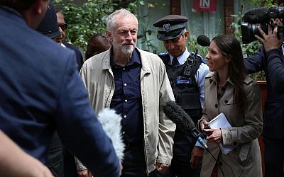 UK Labour Party leader Jeremy Corbyn faces the media as he leaves his house in London, June 26, 2016. (Isabel Infantes/PA via AP)