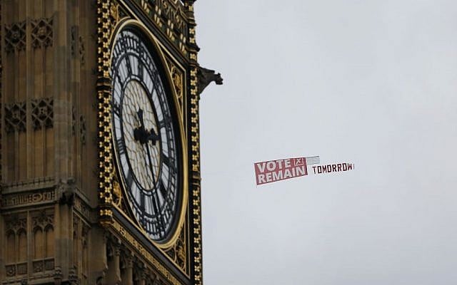 A pro-EU banner being towed behind a plane, passes the clock commonly known as Big Ben in Elizabeth Tower in the Houses of Parliament in London, Wednesday June 22, 2016 on the final day of the EU referendum campaign before Britain goes to the polls to vote on continuing its membership of the EU. (AP Photo/Alastair Grant)