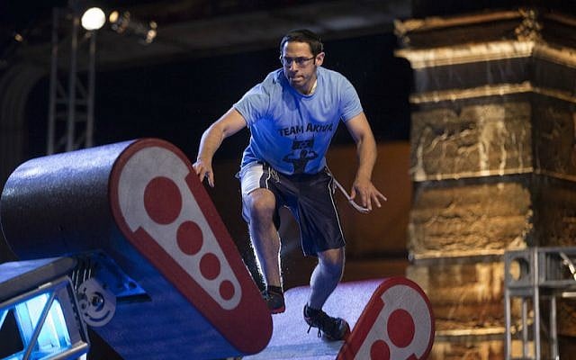 Akiva Neuman, an Orthodox Jew who is studying to be a rabbi, competing in the Philadelphia qualifying round of “American Ninja Warrior.” (Mitchell Leff/NBC via JTA) Akiva Neuman, an Orthodox Jew who is studying to be a rabbi, competing in the Philadelphia qualifying round of “American Ninja Warrior.” (Mitchell Leff/NBC via JTA)