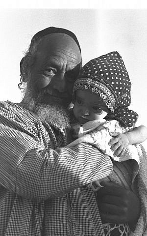 A Yemenite man looks after his grandchild in 1949 (Eldan David/GPO)
