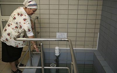 Illustrative photo of a ritual bath attendant, a woman who checks that the immersion in the bath is kosher according to the Jewish tradition. (Hadas Parush/Flash 90)