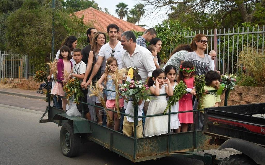 There's more than one way to celebrate Shavuot; a cartful of celebrants at Moshav Kfar Hess, Shavuot 2015 (Courtesy Flash 90) There's more than one way to celebrate Shavuot; a cartful of celebrants at Moshav Kfar Hess, Shavuot 2015 (Courtesy Flash 90)