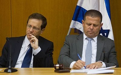 Zionist Union leader Isaac Herzog (L) and MK Eitan Cabel attend a faction meeting at the Knesset on June 8, 2015 (Miriam Alster/Flash90)