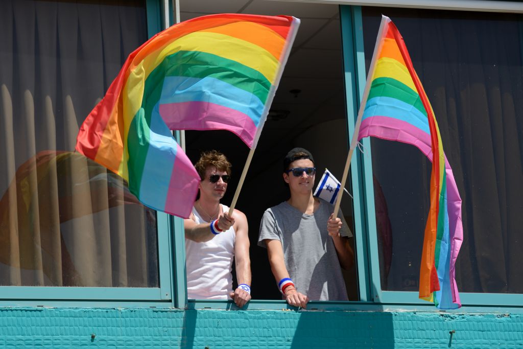 Hanging out the Gay Pride flags in Tel Aviv at the 2015 Gay Pride parade. (Gili Yaari/Flash90) Hanging out the Gay Pride flags in Tel Aviv at the 2015 Gay Pride parade. (Gili Yaari/Flash90)