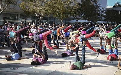 Israelis practice yoga at Habima Square in March 2016 (Courtesy Flash 90)