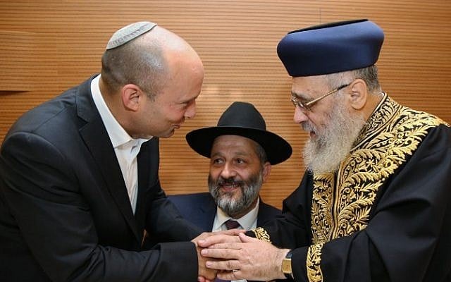 Naftali Bennett (left) and Aryeh Deri (center) with Chief Rabbi Yitzhak Yosef (right) ahead of Yosef's daughter's wedding, on June 2, 2016. (Yaakov Cohen/Flash90) Naftali Bennett (left) and Aryeh Deri (center) with Chief Rabbi Yitzhak Yosef (right) ahead of Yosef's daughter's wedding, on June 2, 2016. (Yaakov Cohen/Flash90)