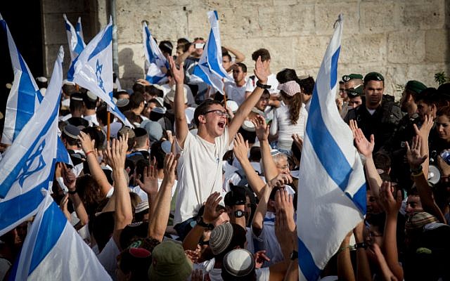 Illustrative: Thousands of young Jewish boys wave Israeli flags as they celebrate Jerusalem Day, dancing and marching their way through Damascus Gate on the way to the Western Wall of Jerusalem's Old City, June 5, 2016. (Nati Shohat/Flash90) Illustrative: Thousands of young Jewish boys wave Israeli flags as they celebrate Jerusalem Day, dancing and marching their way through Damascus Gate on the way to the Western Wall of Jerusalem's Old City, June 5, 2016. (Nati Shohat/Flash90)