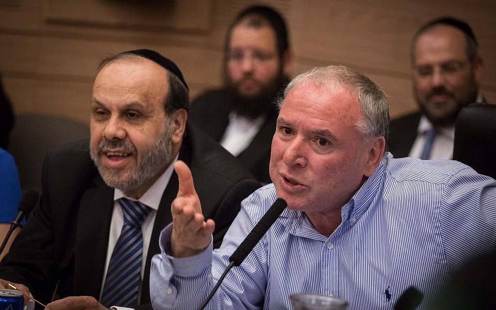 Religious Affairs Minister David Azoulai (Shas, left) and MK David Amsalem (Likud) at the Interior Affairs Committee meeting on a law proposal for changing regulations at ritual baths, on June 6, 2016. (Hadas Parush/Flash90)