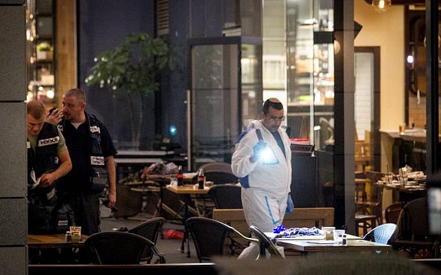 Israeli police at the scene of a terror attack at Tel Aviv's Sarona Market on June 8, 2016. (Miriam Alster/Flash90) Israeli police at the scene of a terror attack at Tel Aviv's Sarona Market on June 8, 2016. (Miriam Alster/Flash90)
