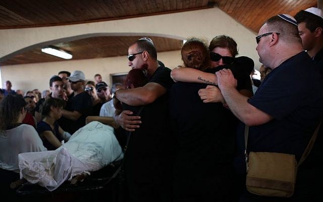 Family and friends at the funeral of Ido Ben Ari, 42, in Yavne, June 9, 2016. Ben Ari died in the Sarona Market terror attack in Tel Aviv on June 8, 2016. (Miriam Alster/Flash90) Family and friends at the funeral of Ido Ben Ari, 42, in Yavne, June 9, 2016. Ben Ari died in the Sarona Market terror attack in Tel Aviv on June 8, 2016. (Miriam Alster/Flash90)