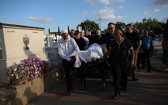 Family and friends at the June 9, 2016 funeral of Ido Ben Ari, 42, in Yavneh. Ben Ari died in the Sarona Market terror attack in Tel Aviv the day before. (Miriam Alster/Flash90)