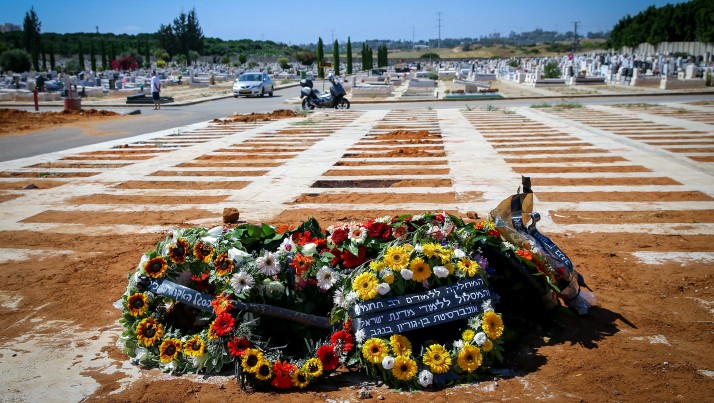 Flowers on the grave of Dr. Michael Feige, following his funeral at the cemetery in Rehovot, June 10, 2016. Feige was killed in a shooting attack at the Sarona Market in central Tel Aviv on June 8. (Flash90) Flowers on the grave of Dr. Michael Feige, following his funeral at the cemetery in Rehovot, June 10, 2016. Feige was killed in a shooting attack at the Sarona Market in central Tel Aviv on June 8. (Flash90)