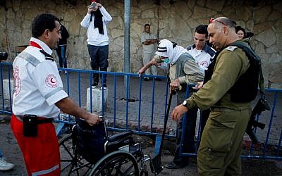 Palestinians cross from the West Bank city of Bethlehem as they head to the Al-Aqsa Mosque in Jerusalem's Old City to attend the first Friday prayers of Ramadan on June 10, 2016. (Photo by Wisam Hashlamoun/FLASH90) Palestinians cross from the West Bank city of Bethlehem as they head to the Al-Aqsa Mosque in Jerusalem's Old City to attend the first Friday prayers of Ramadan on June 10, 2016. (Photo by Wisam Hashlamoun/FLASH90)