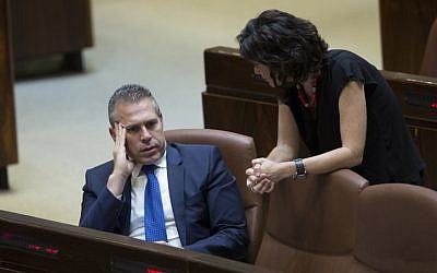 Knesset Member Tamar Zandberg speaks with Public Security Minister Gilad Erdan at the plenary session at the Knesset on June 13, 2016. (Noam Revkin-Fenton/Flash90)