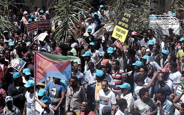 Eritrean migrants protest in front of the European Union embassy in Ramat Gan, calling for the UN to try the Eritrean leadership for crimes against humanity, on June 21, 2016. (Tomer Neuberg/Flash90) Eritrean migrants protest in front of the European Union embassy in Ramat Gan, calling for the UN to try the Eritrean leadership for crimes against humanity, on June 21, 2016. (Tomer Neuberg/Flash90)