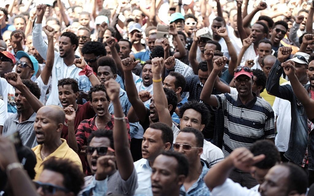 Eritrean migrants protest in front of the European Union embassy in Ramat Gan, calling for the UN to try the Eritrean leadership for crimes against humanity, on June 21, 2016. (Tomer Neuberg/Flash90)