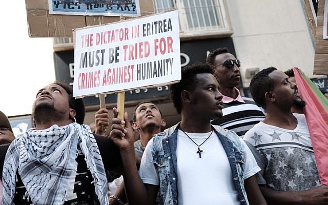 Eritrean migrants protest in front of the European Union embassy in Ramat Gan, calling for the UN to try the Eritrean leadership for crimes against humanity, on June 21, 2016. (Tomer Neuberg/Flash90) Eritrean migrants protest in front of the European Union embassy in Ramat Gan, calling for the UN to try the Eritrean leadership for crimes against humanity, on June 21, 2016. (Tomer Neuberg/Flash90)