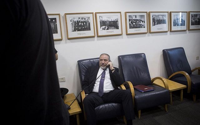 Avigdor Liberman speaks on the phone during the weekly cabinet meeting at the Prime Minister's Office in Jerusalem on June 26, 2016. (Miriam Alster/FLASH90) Avigdor Liberman speaks on the phone during the weekly cabinet meeting at the Prime Minister's Office in Jerusalem on June 26, 2016. (Miriam Alster/FLASH90)