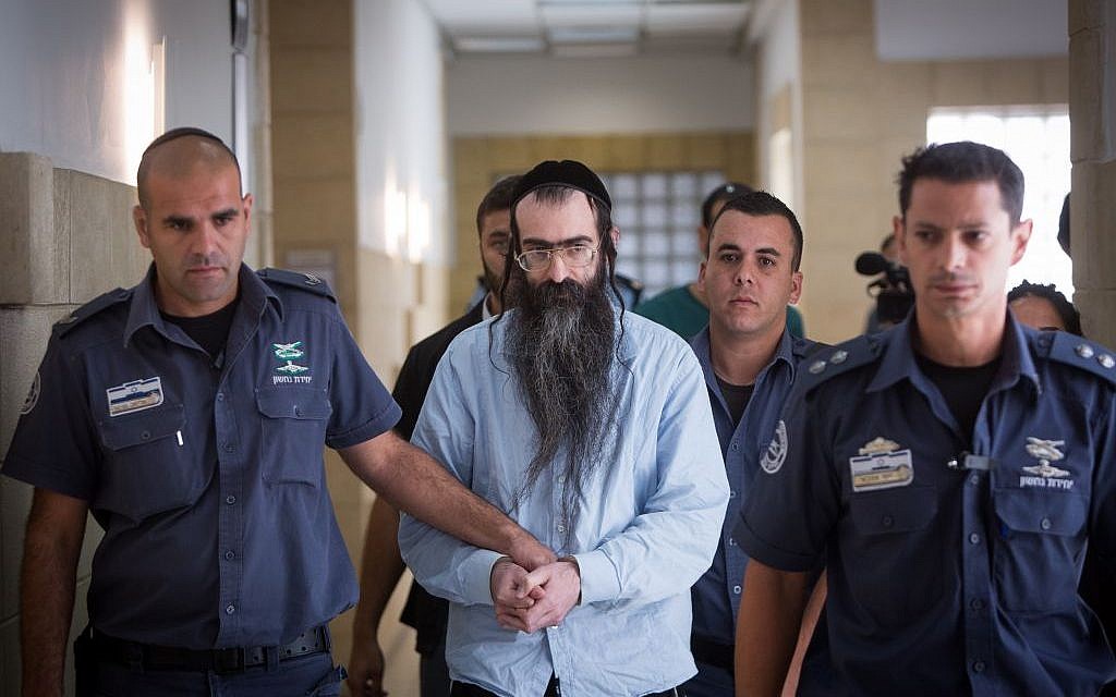 Gay pride stabber Yishai Schlissel is led out of the courtroom, at the Jerusalem District Court on June 26, 2016, after being sentenced to life in prison and an additional 31 years (Yonatan Sindel/Flash90) Gay pride stabber Yishai Schlissel is led out of the courtroom, at the Jerusalem District Court on June 26, 2016, after being sentenced to life in prison and an additional 31 years (Yonatan Sindel/Flash90)
