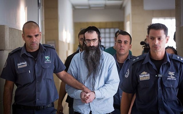 Gay pride stabber Yishai Schlissel is led out of the courtroom, at the Jerusalem District Court on June 26, 2016, after being sentenced to life in prison and an additional 31 years (Yonatan Sindel/Flash90) Gay pride stabber Yishai Schlissel is led out of the courtroom, at the Jerusalem District Court on June 26, 2016, after being sentenced to life in prison and an additional 31 years (Yonatan Sindel/Flash90)