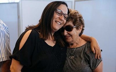 Survivors of Operation Thunderbolt, the Israeli rescue of over 100 hostages from Uganda on July 4, 1976, hug during an event at the Peres Center for Peace in Jaffa marking 40 years since the kidnapping, on June 27, 2016. (Ben Kelmer/FLASH90) Survivors of Operation Thunderbolt, the Israeli rescue of over 100 hostages from the Entebbe Airport in Uganda on July 4, 1976, hug during an event at the Peres Center for Peace in Jaffa marking 40 years since the kidnapping, on June 27, 2016. (Ben Kelmer/FLASH90)