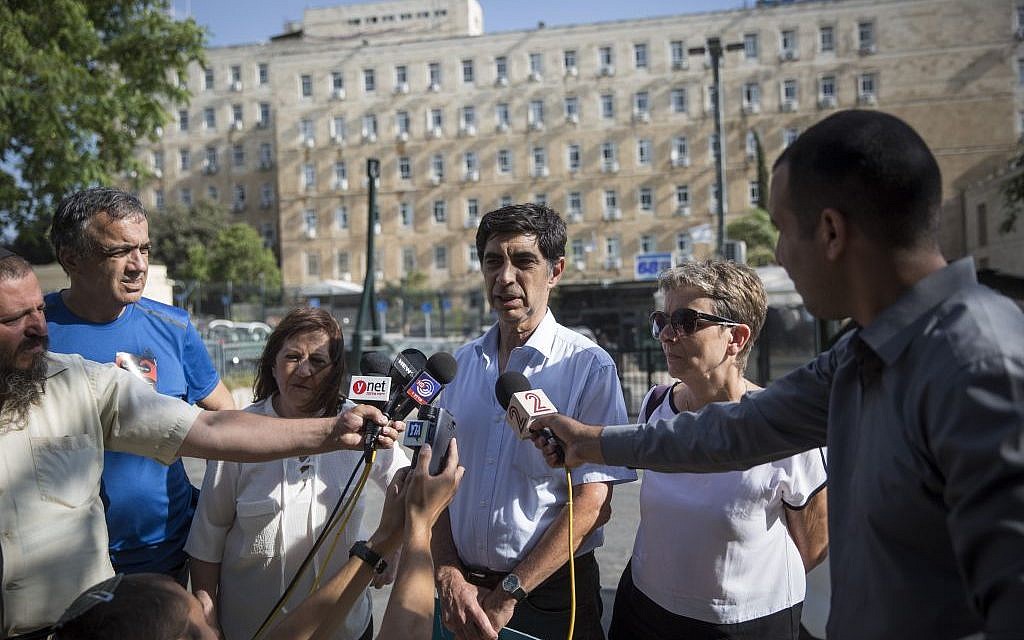 The parents of Hadar Goldin and Oron Shaul speak to the media in Jerusalem on June 28, 2016. (Hadas Parush/Flash90)
