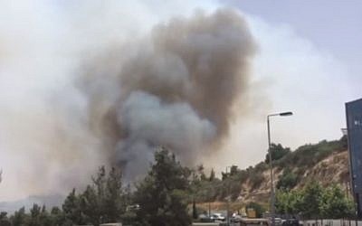 Screen capture of a forest fire that started in the outskirts of Jerusalem , June 15, 2016. (YouTube/Times of Israel)