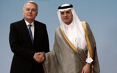 French Foreign Minister Jean-Marc Ayrault shakes hands with Saudi Foreign Minister Adel al-Jubeir prior to an international meeting to revive the Israeli-Palestinian peace process in Paris, France, Friday, June 2, 2016. (Stephane de Sakutin/Pool Photo via AP)