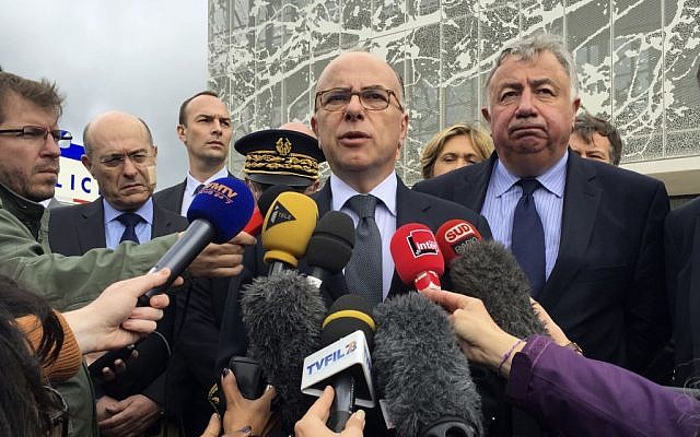 French Interior Minister Bernard Cazeneuve answers reporters after visiting the police station in Les Mureaux, west of Paris, Tuesday, June 14, 2016. (AP/Nadine Achoui-Lesage)