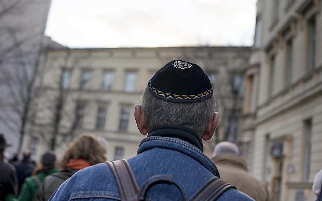 A man wearing a kippah as he takes part in a silent march in Berlin to commemorate the 75th anniversary of the Kristallnacht pogroms, Nov. 9, 2013. (Carsten Koall/Getty Images via JTA) A man wearing a kippah as he takes part in a silent march in Berlin to commemorate the 75th anniversary of the Kristallnacht pogroms, Nov. 9, 2013. (Carsten Koall/Getty Images via JTA)