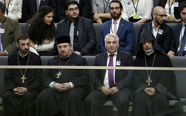 Representatives of the Christian Church of Armenia attend a meeting of the German Federal Parliament, Bundestag, at the Reichstag building in Berlin, Germany, Thursday, June 2, 2016. (AP Photo/Michael Sohn)