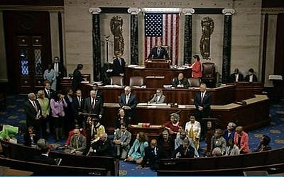 In this frame grab taken from AP video Georgia Rep. John Lewis, center, leads a sit-in of more than 100 Democrats in demanding a vote on measures to expand background checks and block gun purchases by some suspected terrorists. (AP)