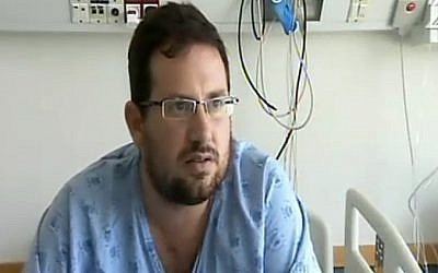 Hagai Klein was injured in the Sarona terror attack on June 8, 2016. He is seen in CCTV footage charging one of the two terrorists carrying out the attack with a chair. (Screenshot/Channel 2)
