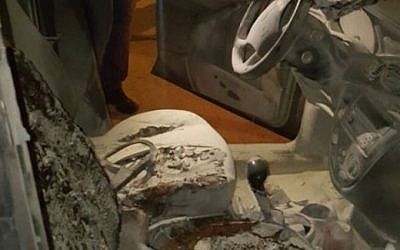 The interior of a torched car belonging to Israeli peace activists that was torched by local Palestinians in the West Bank city of Ramallah on June 29, 2016. (Israel Police)