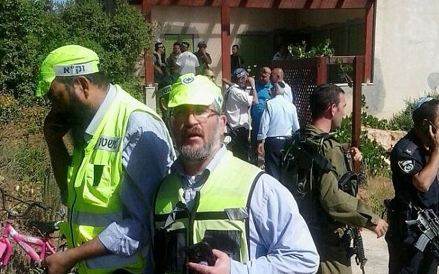 ZAKA volunteers arrive at the scene of a terror attack in Kiryat Arba, on June 30, 2016, in which a 13-year-old girl was stabbed to death. (Nati Shapira)