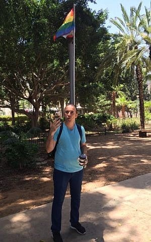 LGBT activist Shai Doitsh guiding a group of visiting journalists in Tel Aviv's Gan Meir for Gay Pride 2016 (Jessica Steinberg/Times of Israel)