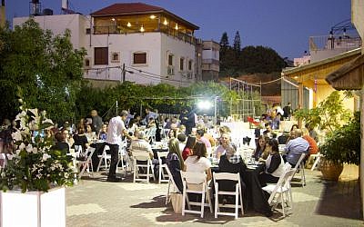 Illustrative: Jews and Arabs sharing an Iftar (break-fast) meal together during the month of Ramadan, in the town of Tayibe, June 9, 2016. (Dov Lieber/Times of Israel)