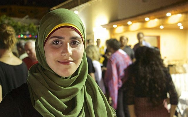 Amena Massarwe, 23, who played the primary hostess for a joint Muslim-Jewish Iftar in the town of Tayibe, June 9, 2016. (Dov Lieber / Times of israel) Amena Massarwe, 23, who played the primary hostess for a joint Muslim-Jewish Iftar in the town of Tayibe, June 9, 2016. (Dov Lieber / Times of israel)