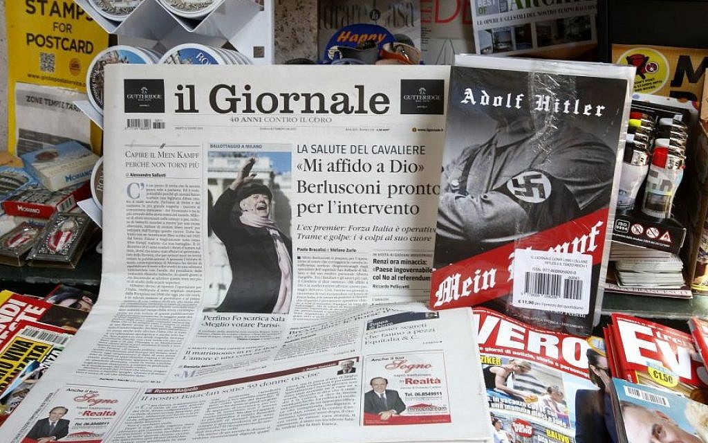 Il Giornale newspaper is seen on sale in a newsstand with Hitler's 'Mein Kampf,' in Rome Saturday, June 11, 2016. (AP/Fabio Frustaci)