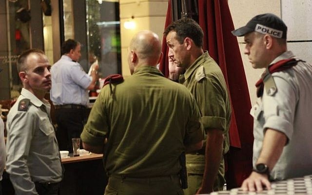 Security officials at the scene of the Sarona complex terror attack in Tel Aviv on June 8, 2016 (Judah Ari Gross/Times of Israel) Security officials at the scene of the Sarona complex terror attack in Tel Aviv on June 8, 2016 (Judah Ari Gross/Times of Israel)