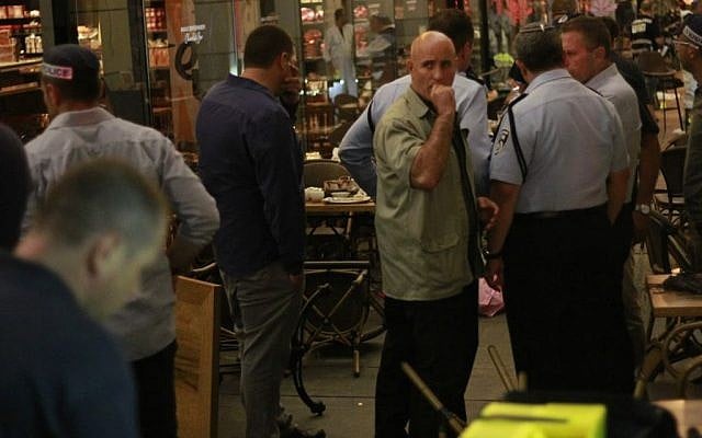 Security officials at the scene of the Sarona complex terror attack in Tel Aviv on June 8, 2016 (Judah Ari Gross/Times of Israel) Security officials at the scene of the Sarona complex terror attack in Tel Aviv on June 8, 2016 (Judah Ari Gross/Times of Israel)