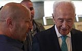 Former Israeli president Shimon Peres speaks with survivor Benny Davidson at an event marking 40 years since Operation Thunderbolt, the Israeli rescue of over 100 hostages from the Entebbe Airport in Uganda on July 4, 1976, which was held at the Peres Center for Peace in Jaffa on June 27, 2016. (Judah Ari Gross/Times of Israel)