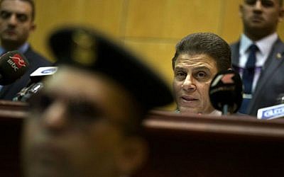 Egyptian judge Mohammed Shirin Fahmy, second right, reads the verdict against former Egyptian President Mohammed Morsi, in a makeshift courtroom at the national police academy, in an eastern suburb of Cairo, Egypt, Saturday, June 18, 2016. (AP Photo/Amr Nabil)