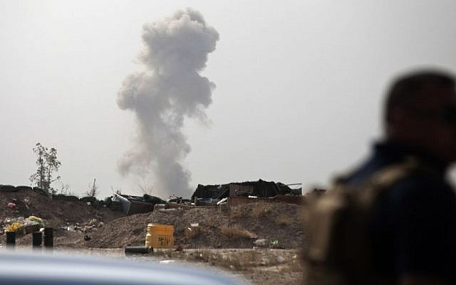 Smoke rises from a car bomb by Islamic State group on the front line in Fallujah, Iraq, Sunday, June 5, 2016. (AP/Maya Alleruzzo)