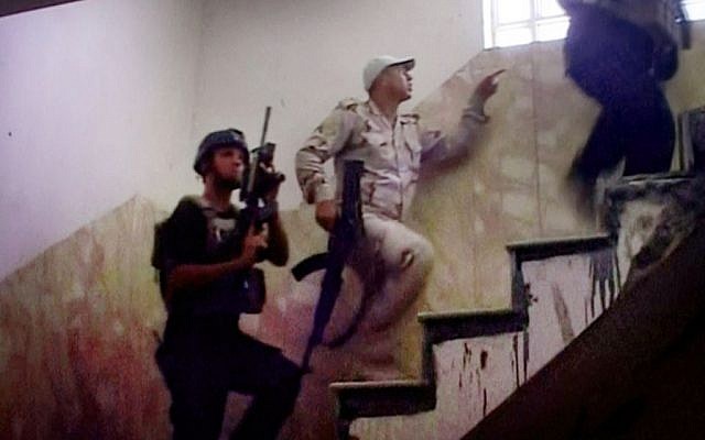 Still image from video of Iraqi soldiers entering a building in Fallujah, Iraq, June 26, 2016. (AP Video via AP) 