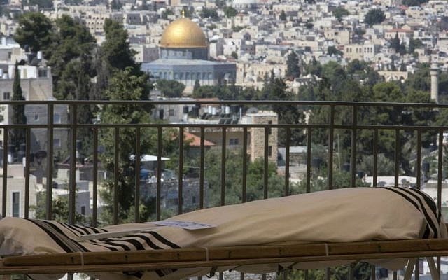 The body of American philanthropist Irving Moskowitz is seen during his funeral in Jerusalem, Monday, June 20, 2016. (AP Photo/Sebastian Scheiner)